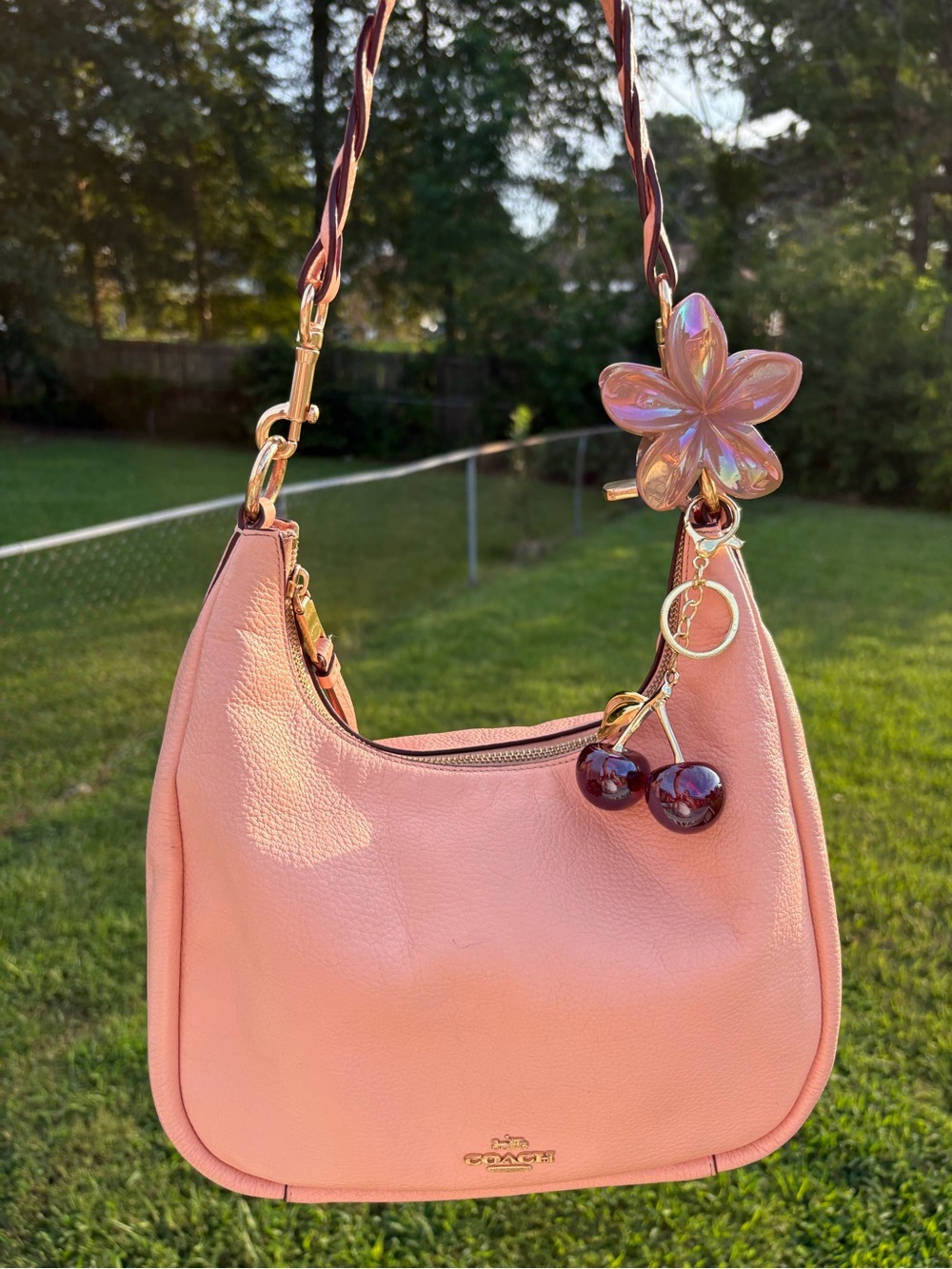 Coach Pink Leather Shoulder Bag with Cherry Charm and Floral Accent